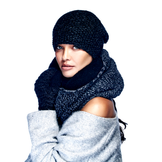 A woman wearing a black hat and a Sherpa Lined Infinity Scarf.