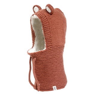 A handmade knitted Teddy Hood in a red color.