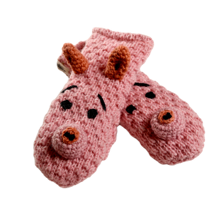 A pair of pink Crochet Piggy Mittens, featuring sherpa lining and a delightful pig face design with contrasting eyes, snouts, and ears. These handmade-in-Nepal mittens are displayed laid on top of each other, showcasing their charming face details.