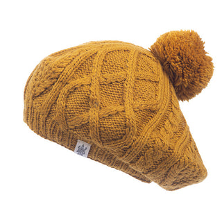 A mustard Yves Beret with a pom pom.