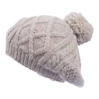 A handmade Yves Beret with a pom pom.