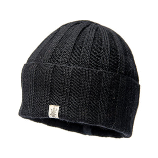 A black Merino wool ribbed beanie on a white background.