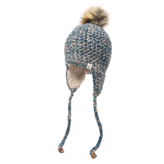 The Chunky Knit Earflap Hat showcases a charming design with its blue and beige color scheme, braided tassels, and a faux fur pom-pom. It features a soft fleece lining inside to provide extra warmth, ensuring both style and functionality.