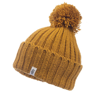 The Park Fold Rib Pom Beanie in mustard is handmade with a pom pom.