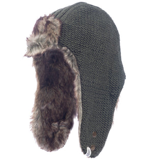 The Winter Trapper Hat is showcased against a white background, featuring green knit material and faux fur lining on the ear flaps. The furry ear flaps are fastened with metal buttons, adding functionality to this woolen winter hat.