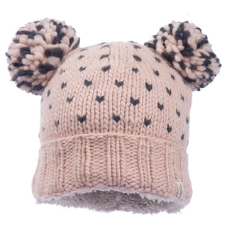 Introducing the delightful Double Pom Kira Hat: a pink knitted beanie made from wool, featuring two large pom-poms on top. Adorned with small, dark heart-like shapes, it includes a ribbed brim and is lined with soft, fluffy material. This charming hat is thoughtfully handmade in Nepal.