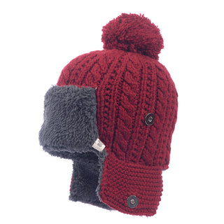 The Sherpa Trapper Hat w/ Pom is a red knitted hat with grey faux fur-lined merino wool ear flaps secured by black buttons on each side, and it comes with a pom-pom on top.