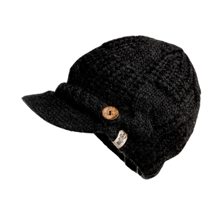 The Broadway Hat is a black cable knit beanie featuring a short brim and accented with a wooden button on the side. It includes a small tag with text near the button, showcasing its stylish knit texture. This essential winter accessory is presented against an isolated white background.