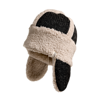 The Arthur Hat, featuring a black and beige patchwork design with ear flaps and a chin strap, is displayed. It has a fuzzy texture and is lined with cozy Sherpa Fleece for added warmth, ensuring you stay comfortable all season long.