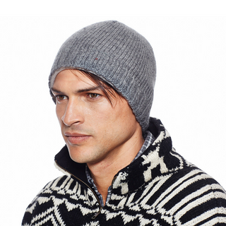 A man wearing a Rib Band beanie and sweater.