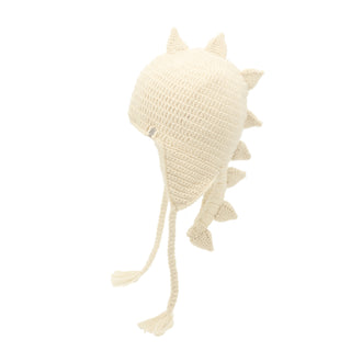 Here's a possible rewrite using the given product data:

The DinoTail Hat is a cream-colored, crocheted dinosaur hat featuring ear flaps, braided tassels, and protruding spikes along the top and back.