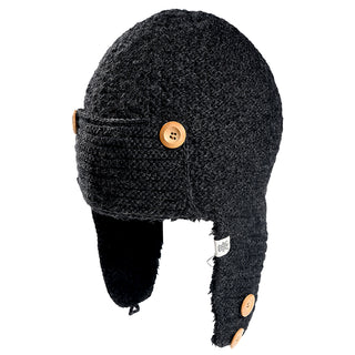 The Elk Hat is a dark gray knit winter hat with ear flaps, featuring four light brown buttons (two per side), a small white fabric tag on the left ear flap, and a textured finish.