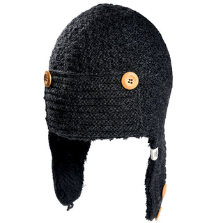 The Elk Hat is a dark gray knit winter hat with ear flaps, lined with black fleece, and features three large brown buttons—two on the front and one on the left ear flap.