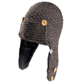 The Elk Hat is a gray knitted trapper hat with ear flaps, lined with black fleece and accented by four tan buttons—two on each side.