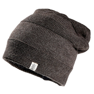 The Edgar Slouch is a dark brown knit beanie with a textured pattern, pictured at an angle on a white background. A small logo fabric tag is attached to the lower edge.