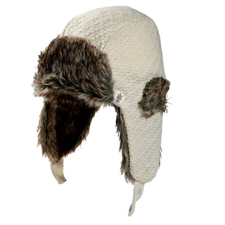 The Fern Hat is a cream-colored knit trapper hat with brown faux fur lining and ear flaps, shown on a white background.