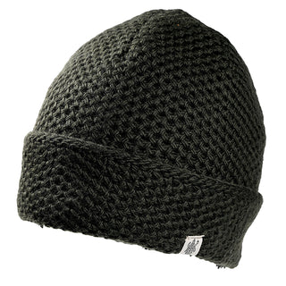 The Baltic Hat is a dark green, thickly knit beanie with a folded brim and a small white fabric tag on the edge, displayed against a plain white background.