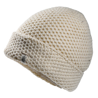 The Baltic Hat is a cream-colored, waffle-knit beanie featuring a folded brim and a small fabric tag on the edge, displayed against a plain white background.
