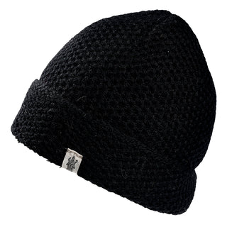 The Baltic Hat is a black knitted beanie with a folded brim and a small white tag on the edge, shown against a white background.