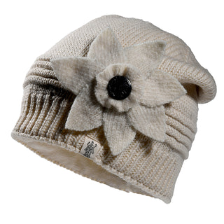 The Monroe Hat is a cream-colored knitted beanie with ribbed detailing and a large felt flower with a button center on the side.