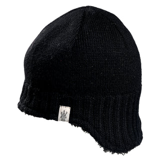 The Dakota Hat is a black knit beanie with a ribbed edge and a small white logo tag. It features a slightly extended back for extra coverage and is shown against a white background.