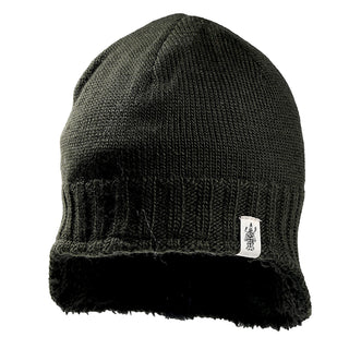 The Dakota Hat is a black knit beanie with a ribbed band, soft fleece lining, and a small white rectangular tag displaying a graphic logo on the front.