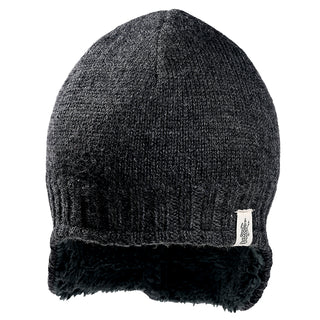 The Dakota Hat is a dark gray knit winter hat with ribbed edges and a black fleece lining. A small white logo tag is sewn onto the lower side.