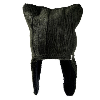 The Ezra Hat is a black knit winter hat featuring two pointed corners on top, long ear flaps on each side, and a soft fleece-like inner lining.