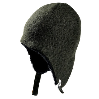 The Doris Hat is a dark green, fleece-lined winter hat featuring ear flaps and a chin strap, displayed from the side against a white background.