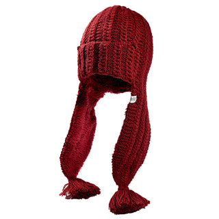 The Alex Hat is a red knitted winter hat featuring long ear flaps and tassels at the ends, shown against a plain white background.