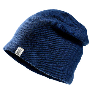 The Depp Slouch is a dark blue knitted beanie with a small white rectangular tag on the edge, shown against a plain white background.