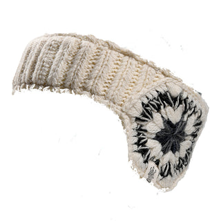The Avon Headband is a chunky, ribbed knit ear warmer in cream with a thick band and a black and gray starburst pattern, designed to be soft and warm.