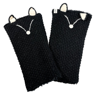 A pair of Fox Legwarmers in black knit featuring small white cat ears and simple white cat face embroidery on the back of each legwarmer.