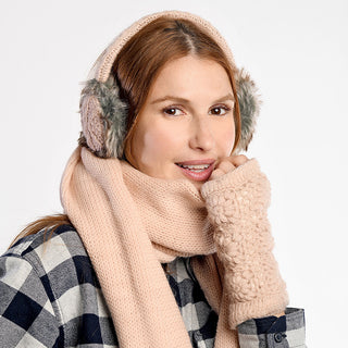 A person wearing a plaid shirt, pink knitted scarf, Cable Knit Adjustable Earmuffs With Faux Fur, and matching pink fingerless gloves looks at the camera against a plain light background.