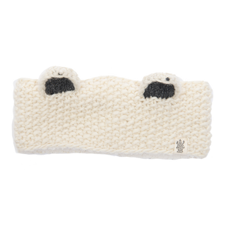 The Ears Headband is a white knitted headband designed to look like a polar bear, featuring two small ears with black inner detailing on top. Handmade in Nepal from 100% wool, it has a small textured tag attached to the lower right corner. The headband is laid flat against a plain white background.
