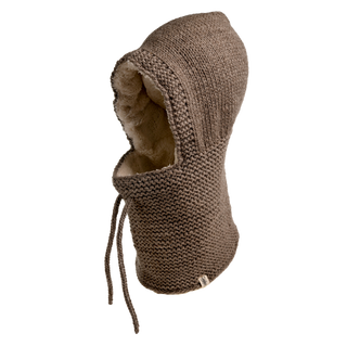 The Eddy Hood, a brown, knitted hood made of Merino wool with a sherpa-like lining, is displayed against a white background. Handmade in Nepal, it features attached scarf parts with strings hanging down for tying or adjusting. The hood appears thick and warm.