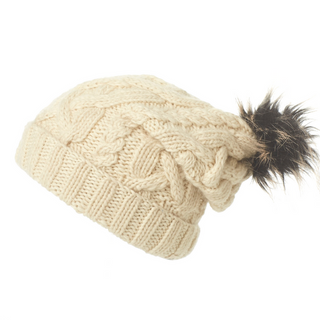 A Sugar Sugar Slouch knitted beanie with a faux fur pom pom.