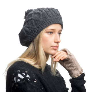 A woman wearing a Yves beret and gloves.