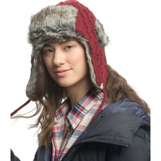 A woman wearing a Cable Knit Russian Hat w/ Faux Fur.