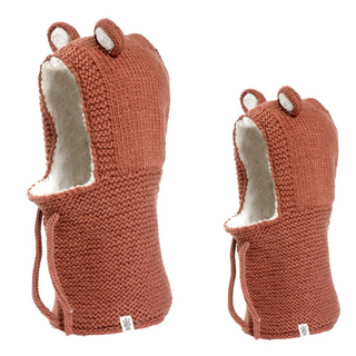 A pair of handmade Teddy Hood bear hats with ears, crafted from merino wool.