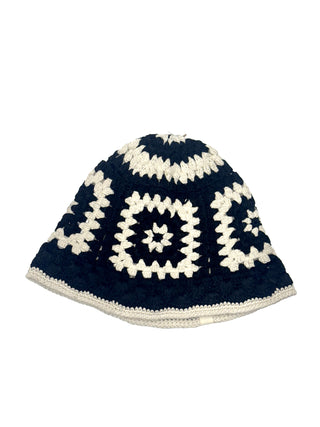 The Cotton Crochet Patch Sun Hat is a black and white crocheted bucket hat with a square pattern and scalloped edges, shown on a plain white background.