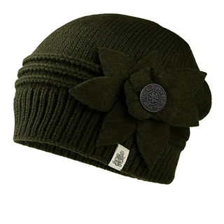 The Monroe Hat is a dark green knitted beanie with a decorative fabric flower, a round button on the side, and a small sewn label near the brim.