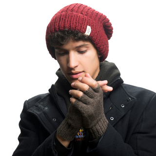 A man wearing a black jacket and Striped and Solid Fingerless Gloves.