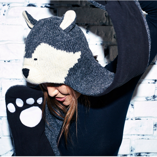 A woman wearing a hand-made Wolf Hatscarf.