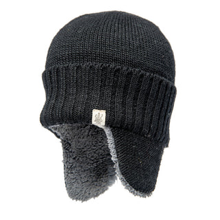 Presenting the Rib Band Earflap Hat: a sleek black winter hat crafted from wool, featuring a ribbed texture and warm gray sherpa-lined ear flaps. This fashionable beanie is highlighted by a small, square metal emblem positioned on the front.